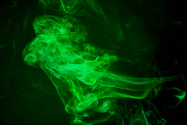 istock Green smoke motion on black background. 847568234