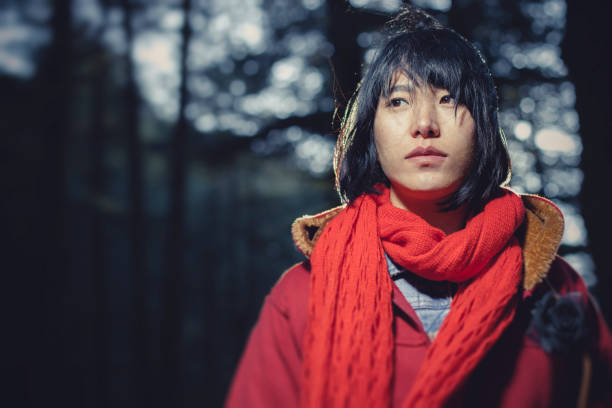 istock Asian young woman standing in woods. 847579460