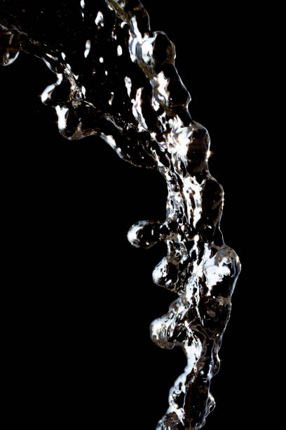 istock stream of water on a black background 847589056