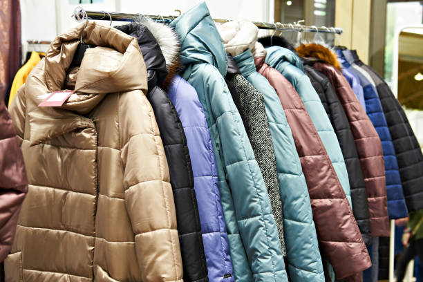 istock Winter women's jackets on hanger in store 847590232