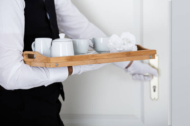 istock Man's Hand Holding Wooden Tray With Coffee Set 847597582