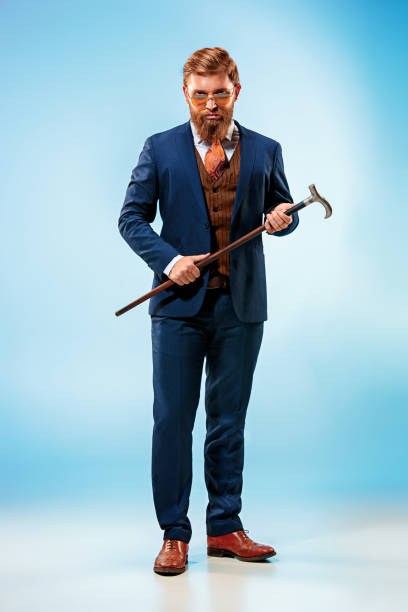 istock The barded man in a suit holding cane 847602302