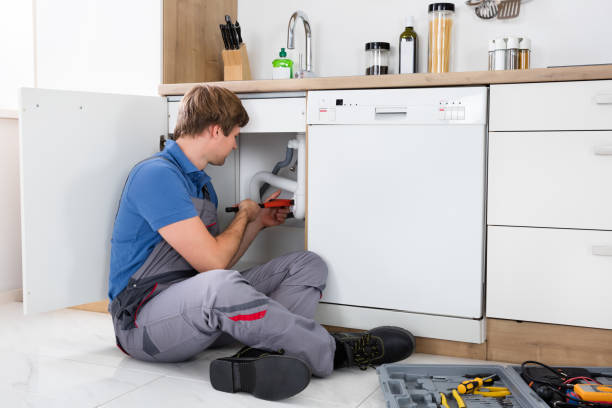 istock Male Plumber Fixing Sink Pipe 847602370