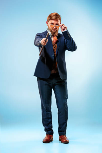 istock The barded man in a suit holding cane 847605926