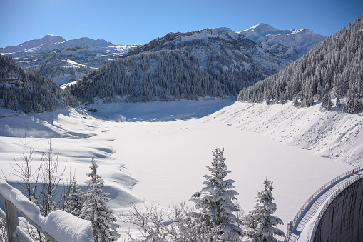 Snow covered landscape in the French AlpsSnow covered landscape in the French Alps with Dam