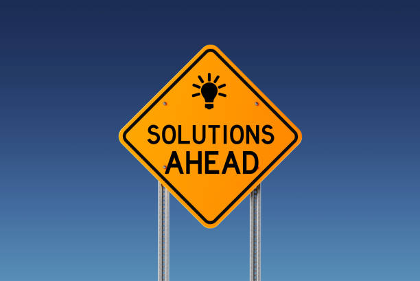 istock Yellow Solutions Ahead Traffic Sign on Blue Sky 847623992