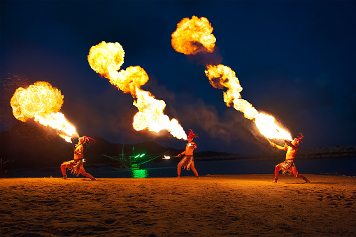 Kho Samui, TH. - March 3, 2017: Fire shows on the beach are a common form of night-time entertainment for visitors at Kho Samui, Thailand.