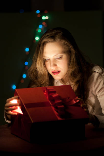 istock The girl opens the Christmas gift 847632658