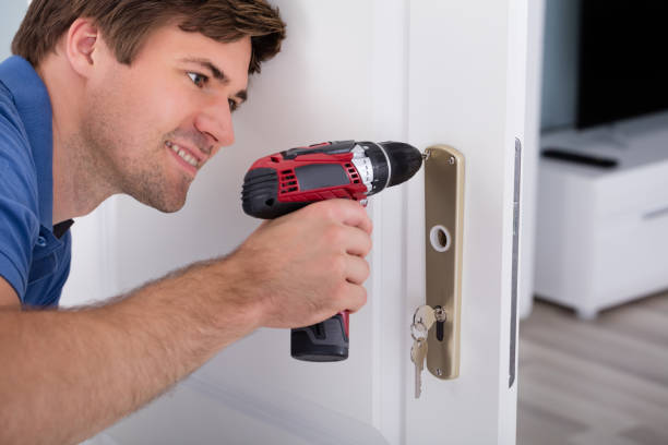 istock Happy Young Male Installing Door Lock 847639724