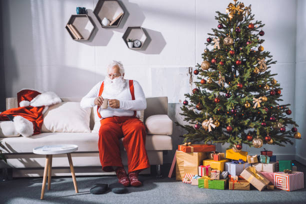 istock santa claus with cup of coffee 847642620