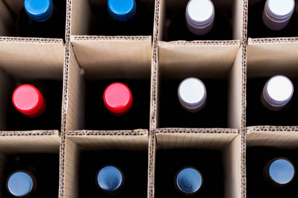 Wine bottles of red and white wine in cardboard box stock photo