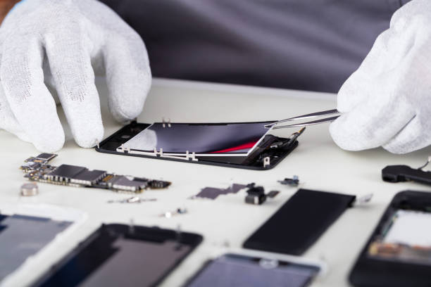 istock Repairman Disassembling Smartphone With Tweezers 847644282
