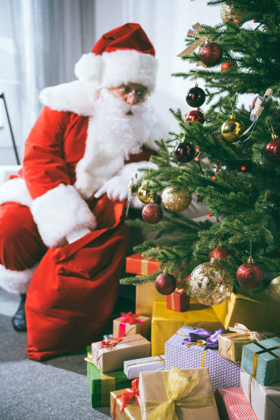 istock santa claus with christmas gift 847645068