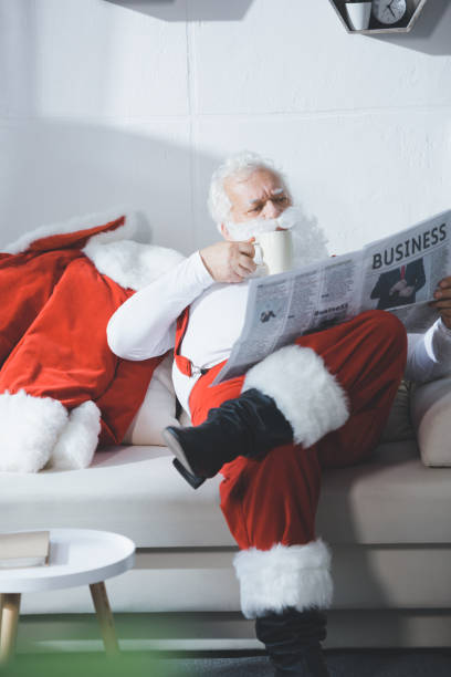 istock santa claus reading newspaper 847645288