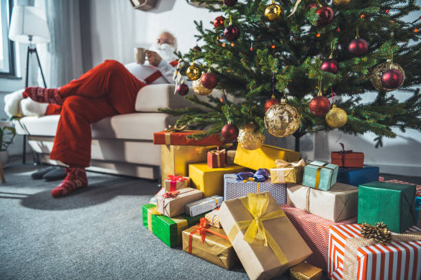 istock santa claus with cup of coffee 847645366