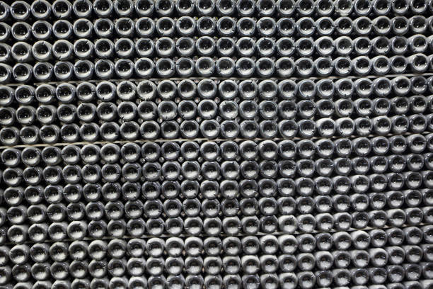 Dusty bottles with sparkling wine in a winery