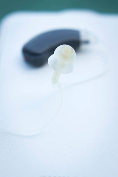 istock Modern digital hearing aid device for deaf and hard of hearing patients. 847663954
