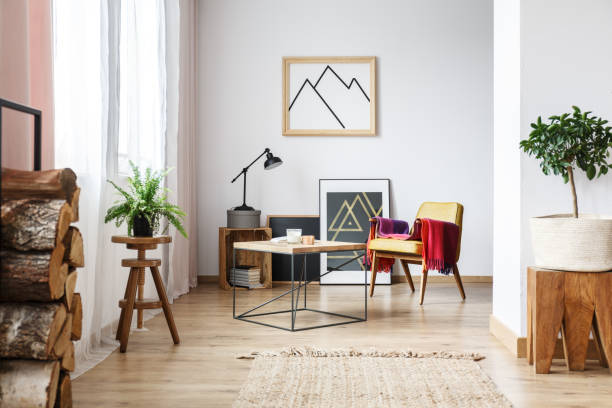 istock Armchair, minimalist poster and firewood 847668264