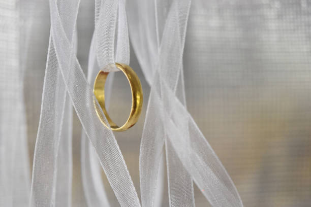 Ring gold with white ribbon mesh has a soft ripple ,Love and remembrance and empty space for text