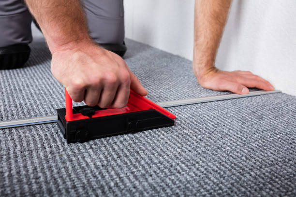 istock Craftsman's Hands Laying Carpet 847670482