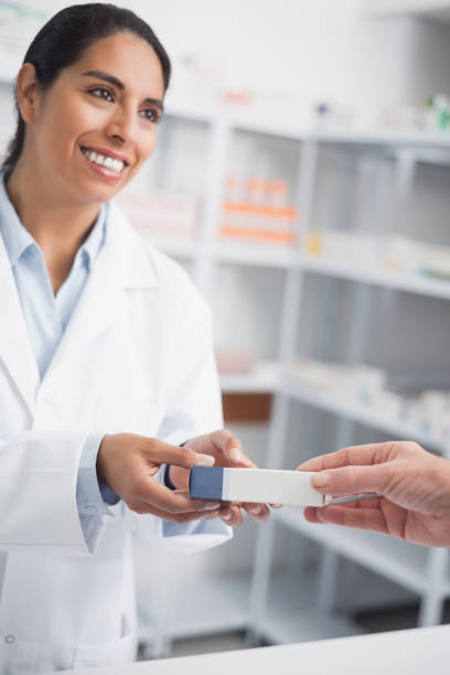 istock Pharmacist giving a drug box to someone 847673278