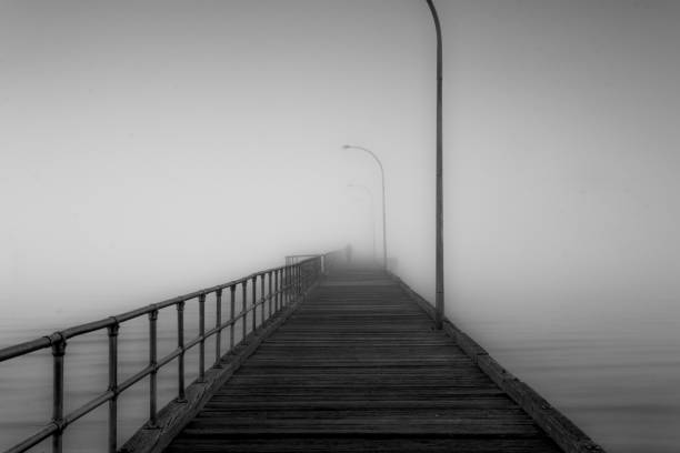 istock A person walking on a pier in fog 847673806