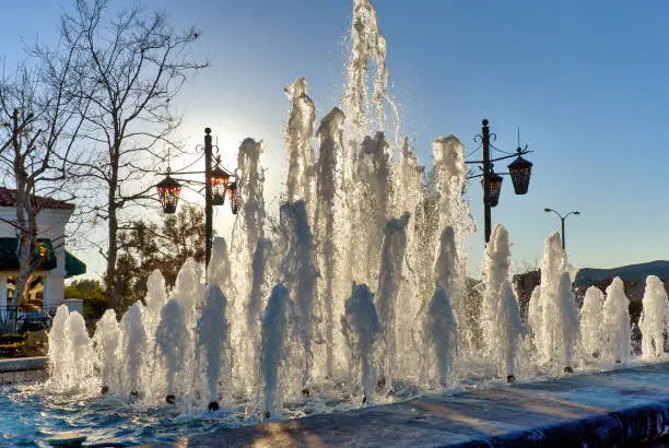 Outdoors water fountains with back lighting in Westlake Village, California, during Christams season.