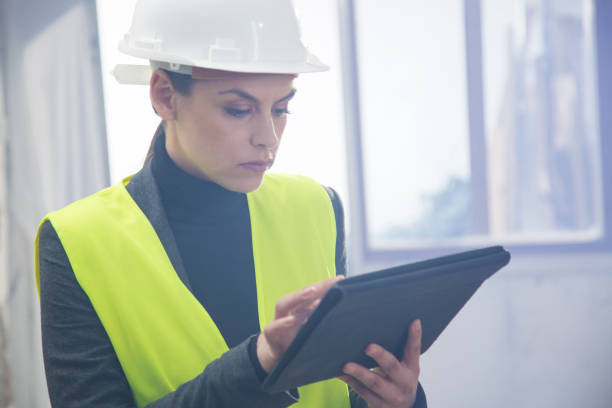 istock Female plumber holding digital tablet 847674080