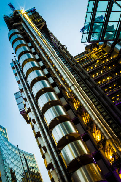 istock Ultra modern architecture illuminated at night, London, UK 847674364