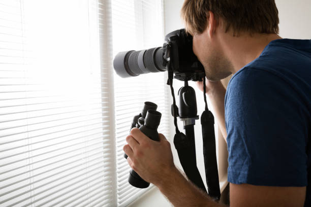 istock Male Holding Camera Photographing 847674596