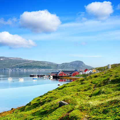 View of the Repvåg fishing village in Nordkapp Municipality, Finnmark county, Norway. Composite photo