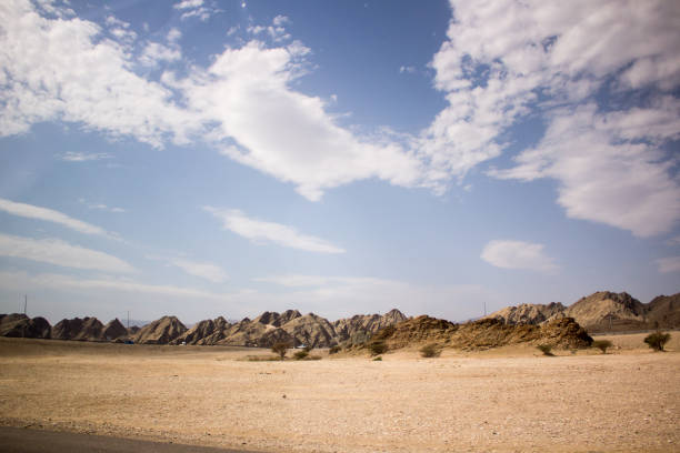 istock Yellow rock mountain in desert in Oman 847680718