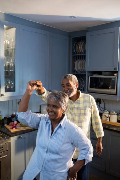 istock Happy senior couple dancing at home 847681310