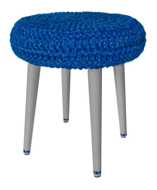 istock Handmade stool wooden gray with blue pattern. Round seat with blue woolen material. 847688918