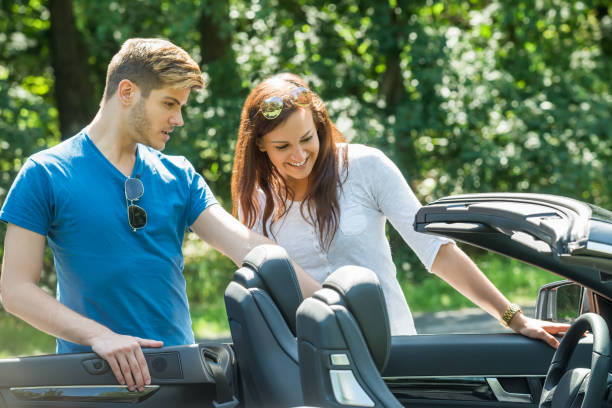 istock Couple Looking At Their Newly Purchased Car 847689466