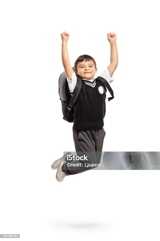 Overjoyed schoolboy jumping and gesturing happiness Overjoyed schoolboy jumping and gesturing happiness isolated on white background Jumping Stock Photo