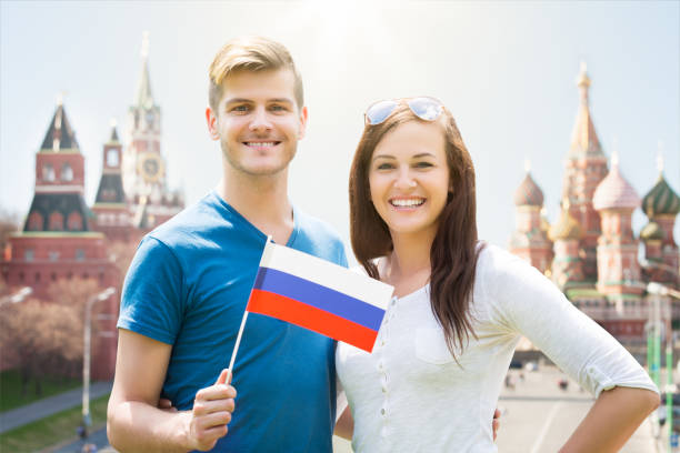istock Young Couple Holding Russia Flag 847693744