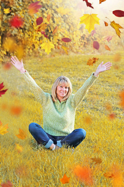 istock Happy mature woman with raised arms 847694862