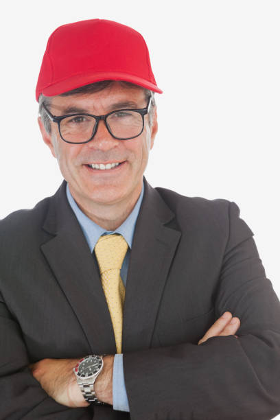 istock Businessman with arms crossed wearing baseball cap 847698288