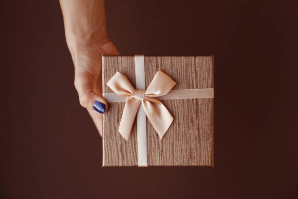 istock Woman hand holding gift box 847701602