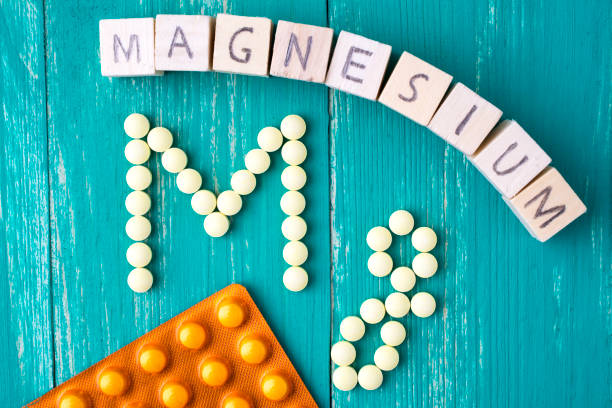 istock Magnesium labeled yellow pills and blister pack - shaped in Mg 847706146