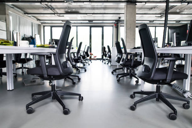 istock The interior of big empty modern office after work. 847710642