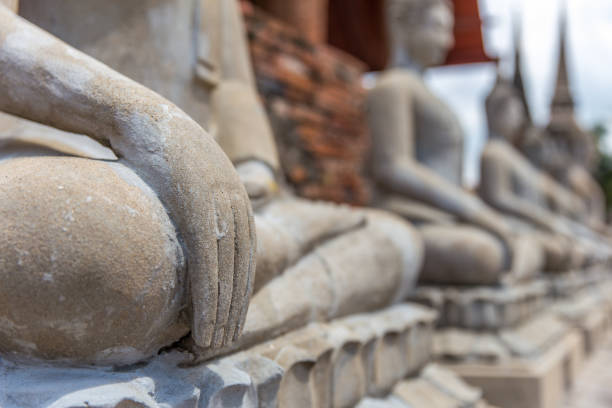 istock Close focus on hand of meditating monk statue 847713012