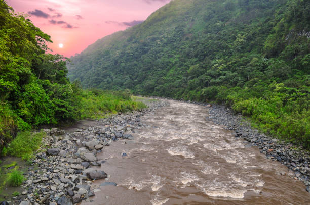 Mountain River in Banos de Agua Santa, Ecuador Mountain River in Banos de Agua Santa, Ecuador mt tungurahua sunset mountain volcano stock pictures, royalty-free photos & images