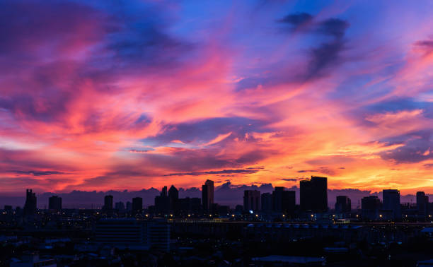istock Dark city covered by colorful morning sky 847713134