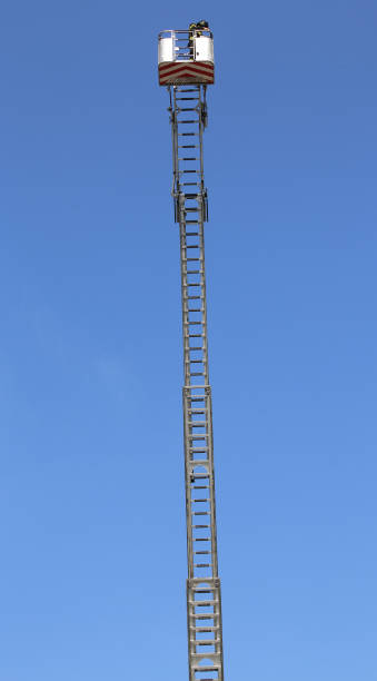 istock Basket with aerial platform over the very long special ladder 847713736