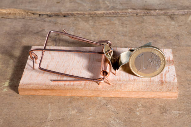 istock Euro coin in a mousetrap 847717512