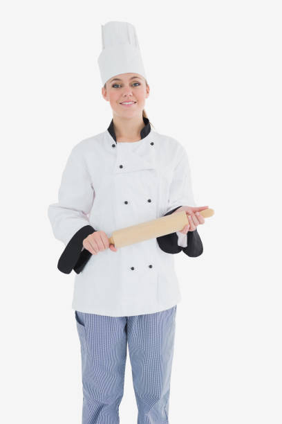 istock Happy female chef holding rolling pin 847717734