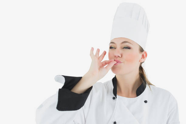 istock Female chef in uniform blowing a kiss 847720478