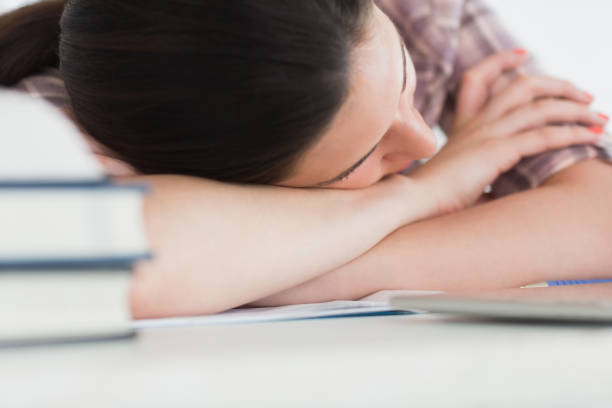istock Woman leaning on the table next to books 847724200